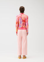 A model wears the Pleats Please Issey Miyake FOGGY FOREST prêt à porter.