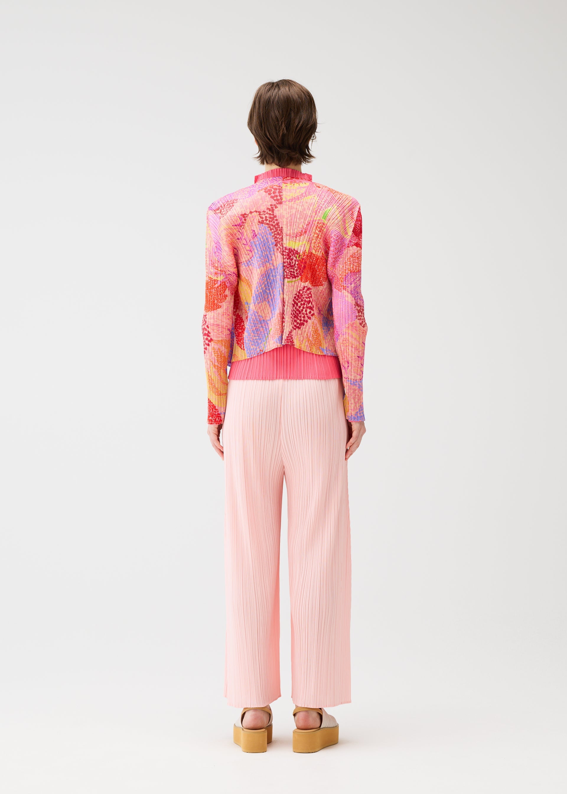 A model wears the Pleats Please Issey Miyake FOGGY FOREST prêt à porter.