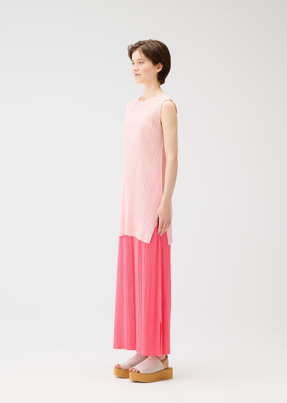 A model wears the Pleats Please Issey Miyake MONTHLY COLORS MARCH prêt à porter.
