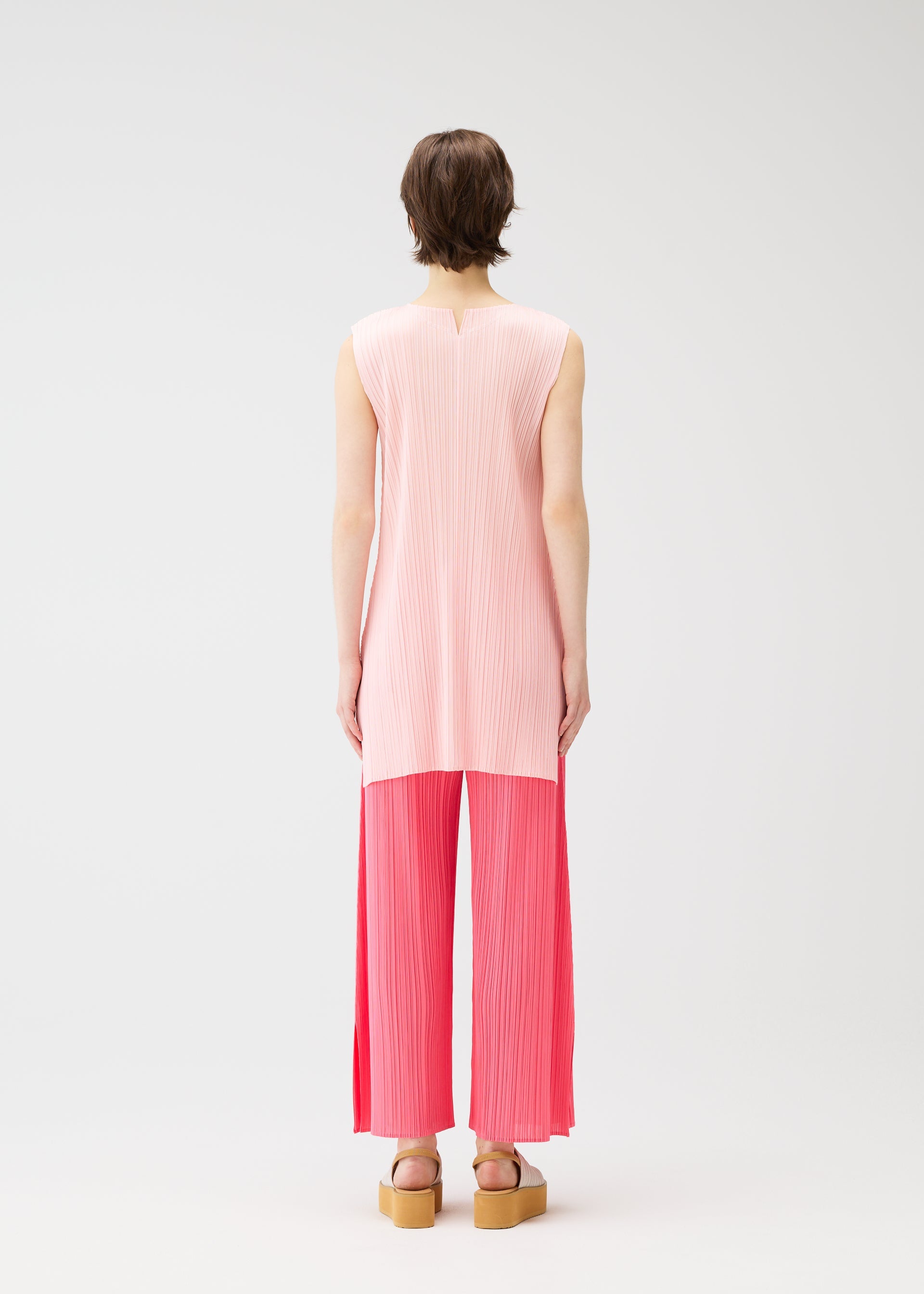 A model wears the Pleats Please Issey Miyake MONTHLY COLORS MARCH prêt à porter.
