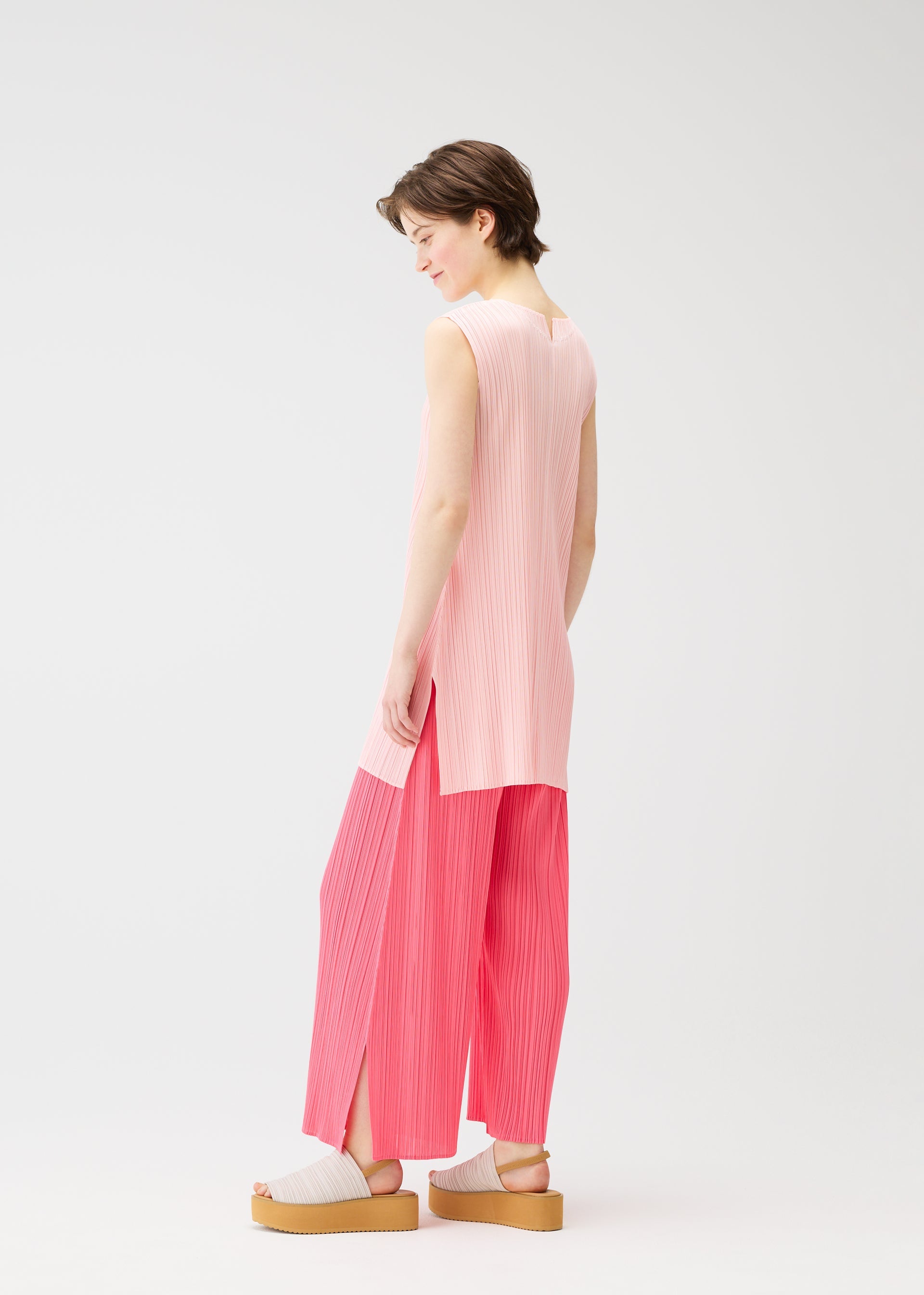 A model wears the Pleats Please Issey Miyake MONTHLY COLORS MARCH prêt à porter.