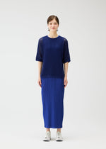 A model wears the Pleats Please Issey Miyake FISHNET KNIT shirt.