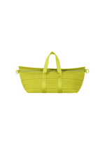 A product shot of the PLEATS PLEASE ISSEY MIYAKE PLEATS BOSTON BAG bag in yellow green.
