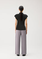 A model wears the PLEATS PLEASE ISSEY MIYAKE MIST AUGUST mist-august-shirt-greyish-green.