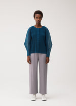 A model wears the PLEATS PLEASE ISSEY MIYAKE TATAMI AUGUST tatami-august-cardigan-off-white.