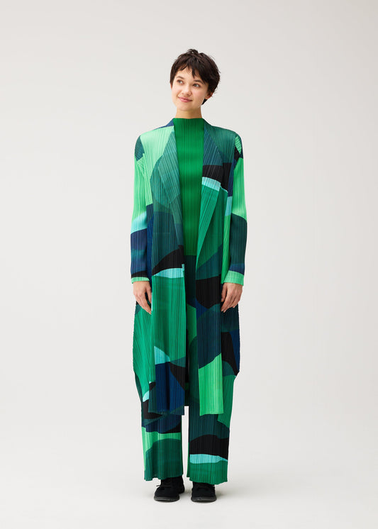 A model wears the PLEATS PLEASE ISSEY MIYAKE ORBIT coat.