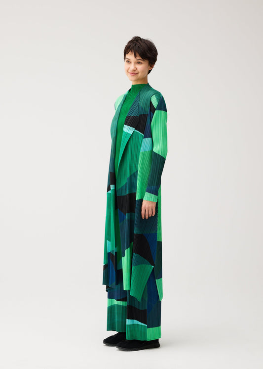 A model wears the PLEATS PLEASE ISSEY MIYAKE ORBIT coat.