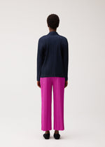A model wears the PLEATS PLEASE ISSEY MIYAKE PLEATS JACKET jacket.