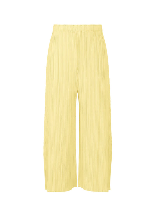 A product shot of the PLEATS PLEASE ISSEY MIYAKE MONTHLY COLORS : JULY trousers in pale yellow.