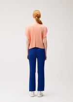 A model wears the PLEATS PLEASE ISSEY MIYAKE MONTHLY COLORS : JULY monthly-colors-july-pants-7.