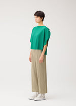 A model wears the PLEATS PLEASE ISSEY MIYAKE THICKER BOTTOMS 1 thicker-bottoms-1-trousers-black-fw26.