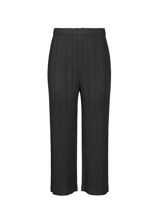 A product shot of the PLEATS PLEASE ISSEY MIYAKE THICKER BOTTOMS 1 trousers in black.