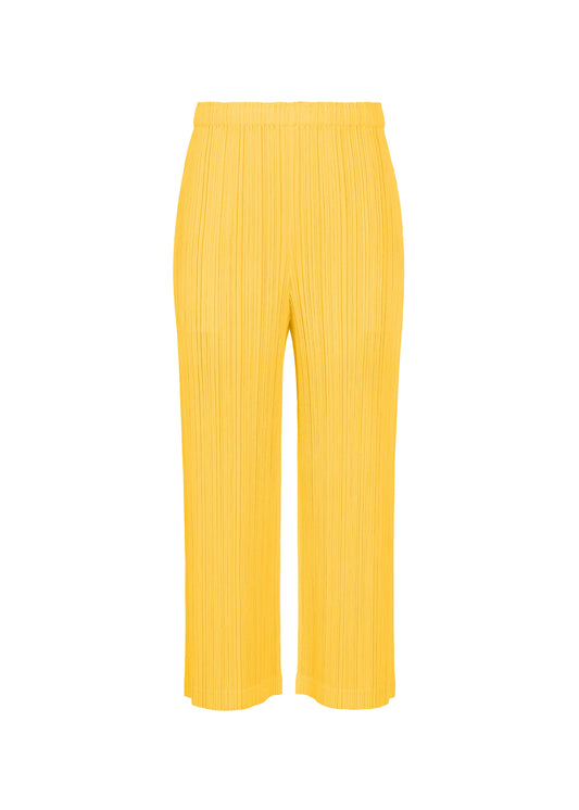 A product shot of the PLEATS PLEASE ISSEY MIYAKE THICKER BOTTOMS 1 pants in yellow.