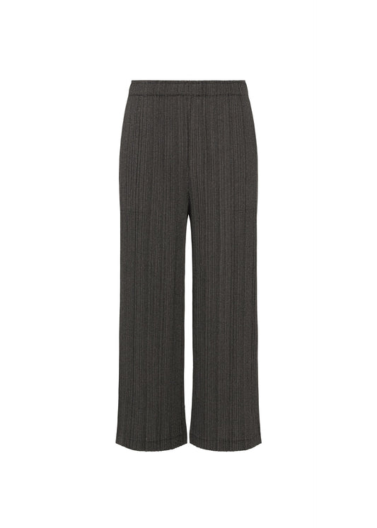A product shot of the PLEATS PLEASE ISSEY MIYAKE COTTON DENIM BLACK trousers in black.