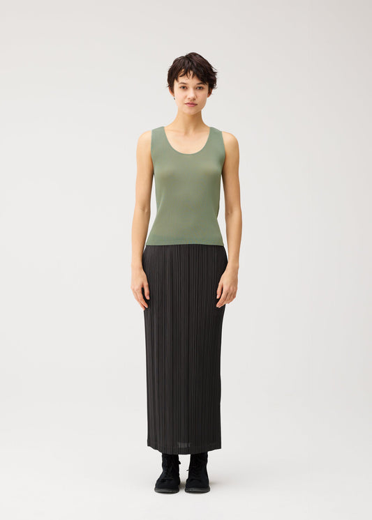 A model wears the PLEATS PLEASE ISSEY MIYAKE THICKER BOTTOMS 2 skirt.