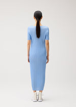 A model wears the PLEATS PLEASE ISSEY MIYAKE MONTHLY COLORS : AUGUST monthly-colors-august-dress-greyish-purple.