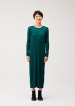 A model wears the PLEATS PLEASE ISSEY MIYAKE MONTHLY COLORS : OCTOBER monthly-colors-october-dress-ash-beige.