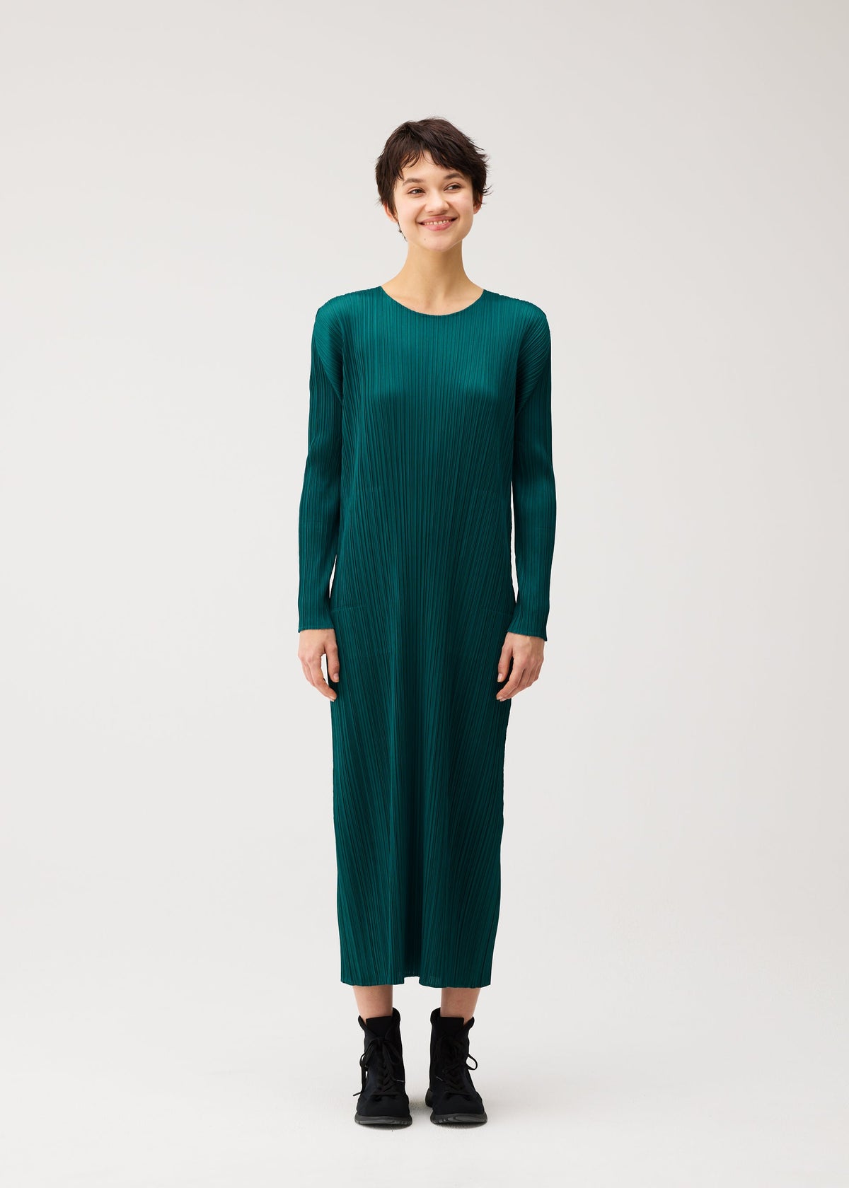 A model wears the PLEATS PLEASE ISSEY MIYAKE MONTHLY COLORS : OCTOBER monthly-colors-october-dress-ash-beige.