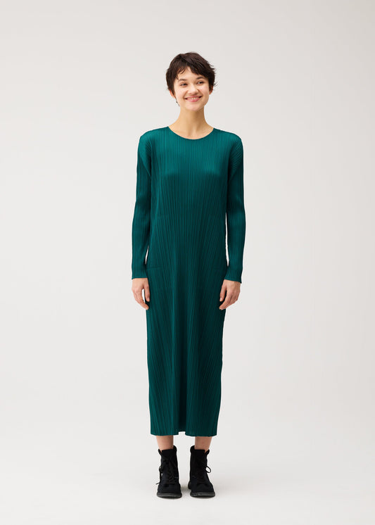 A model wears the PLEATS PLEASE ISSEY MIYAKE MONTHLY COLORS : OCTOBER monthly-colors-october-dress-green-1.