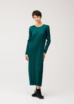 A model wears the PLEATS PLEASE ISSEY MIYAKE MONTHLY COLORS : OCTOBER dress.