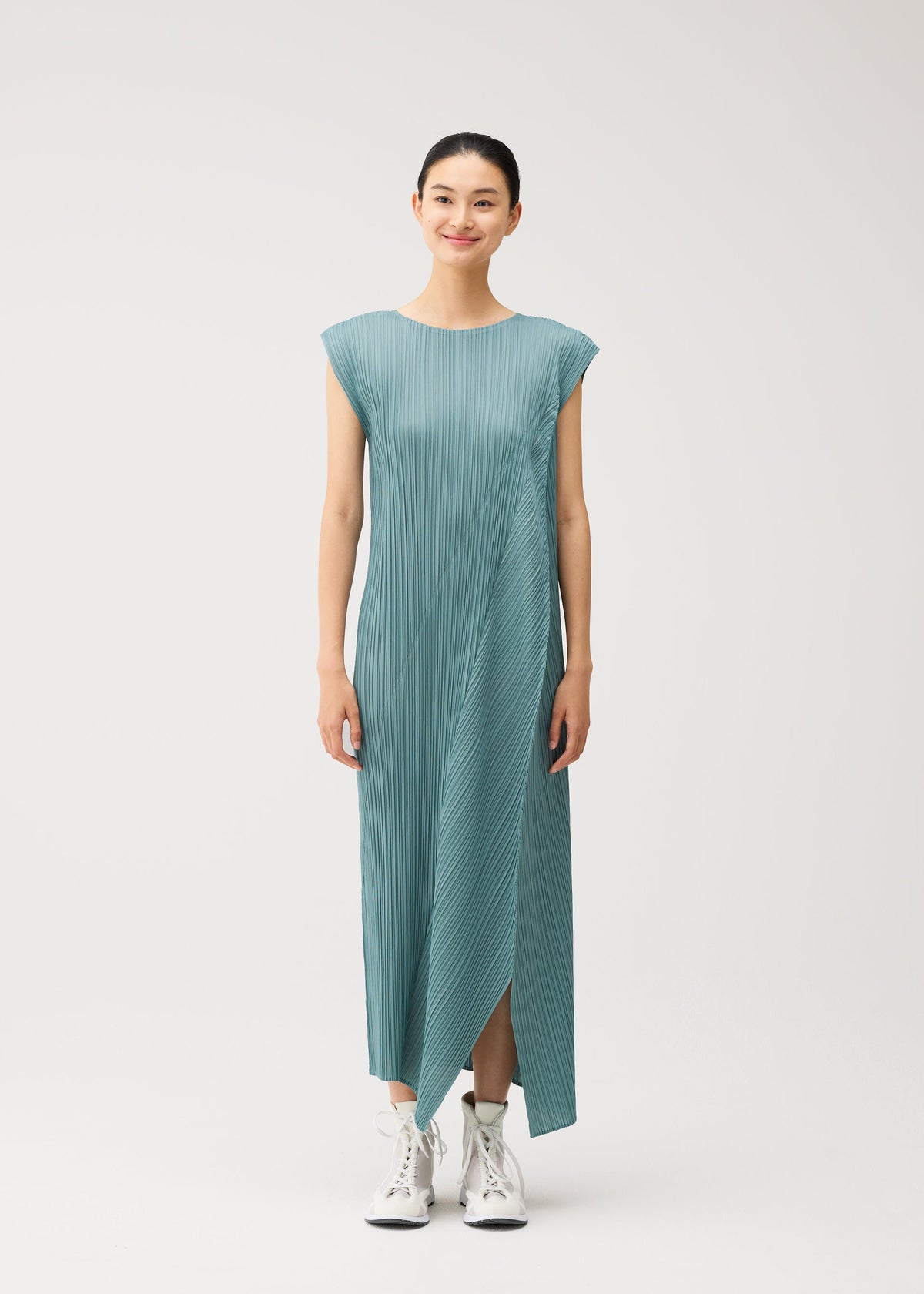 A model wears the PLEATS PLEASE ISSEY MIYAKE FOLD fold-dress-baby-blue.