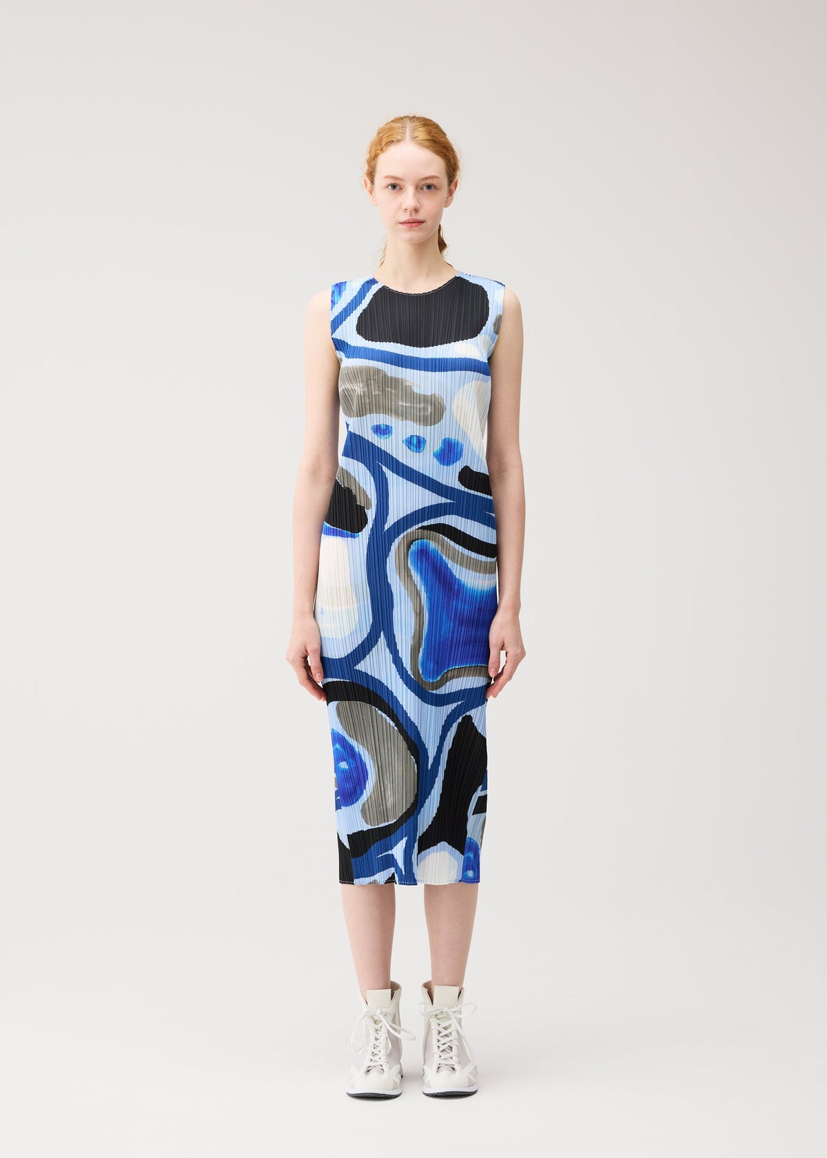 A model wears the PLEATS PLEASE ISSEY MIYAKE ROLL roll-dress-multi-1.