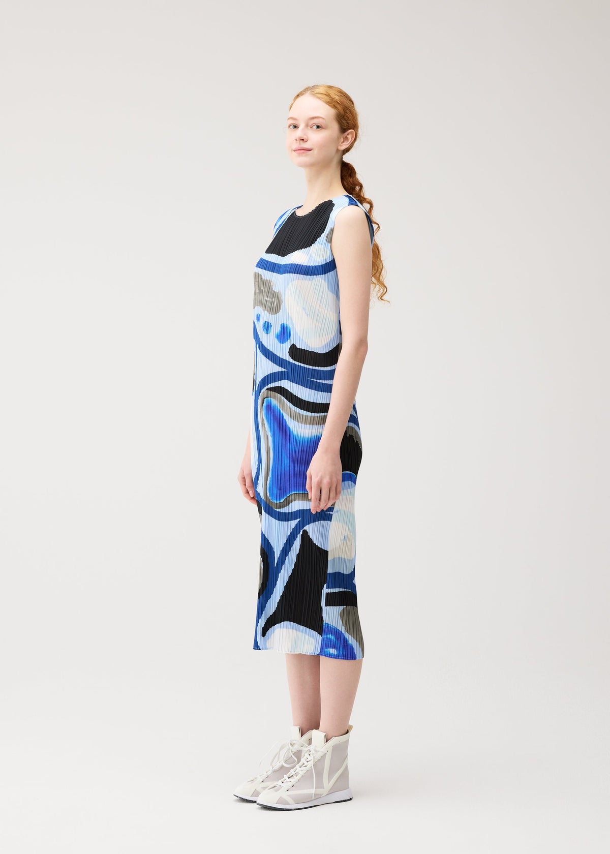 A model wears the PLEATS PLEASE ISSEY MIYAKE ROLL roll-dress-multi-1.