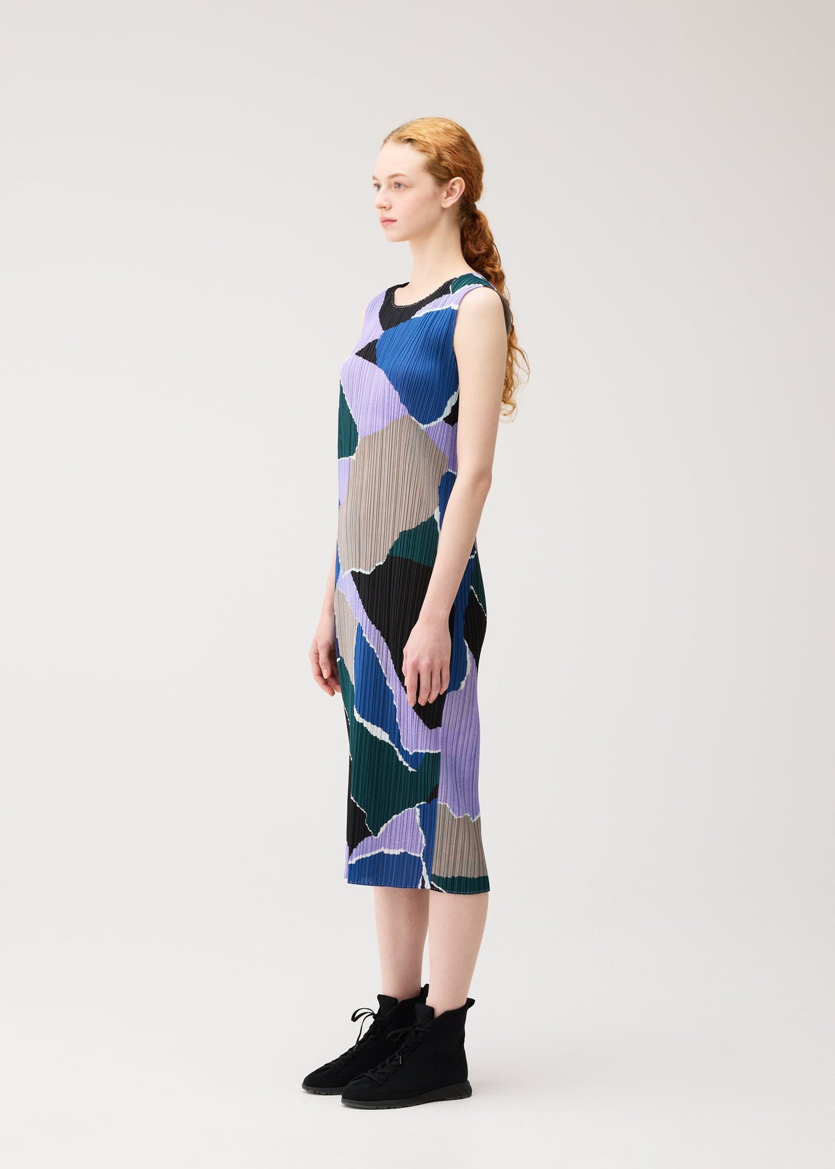 A model wears the PLEATS PLEASE ISSEY MIYAKE SURPRISE! dress.