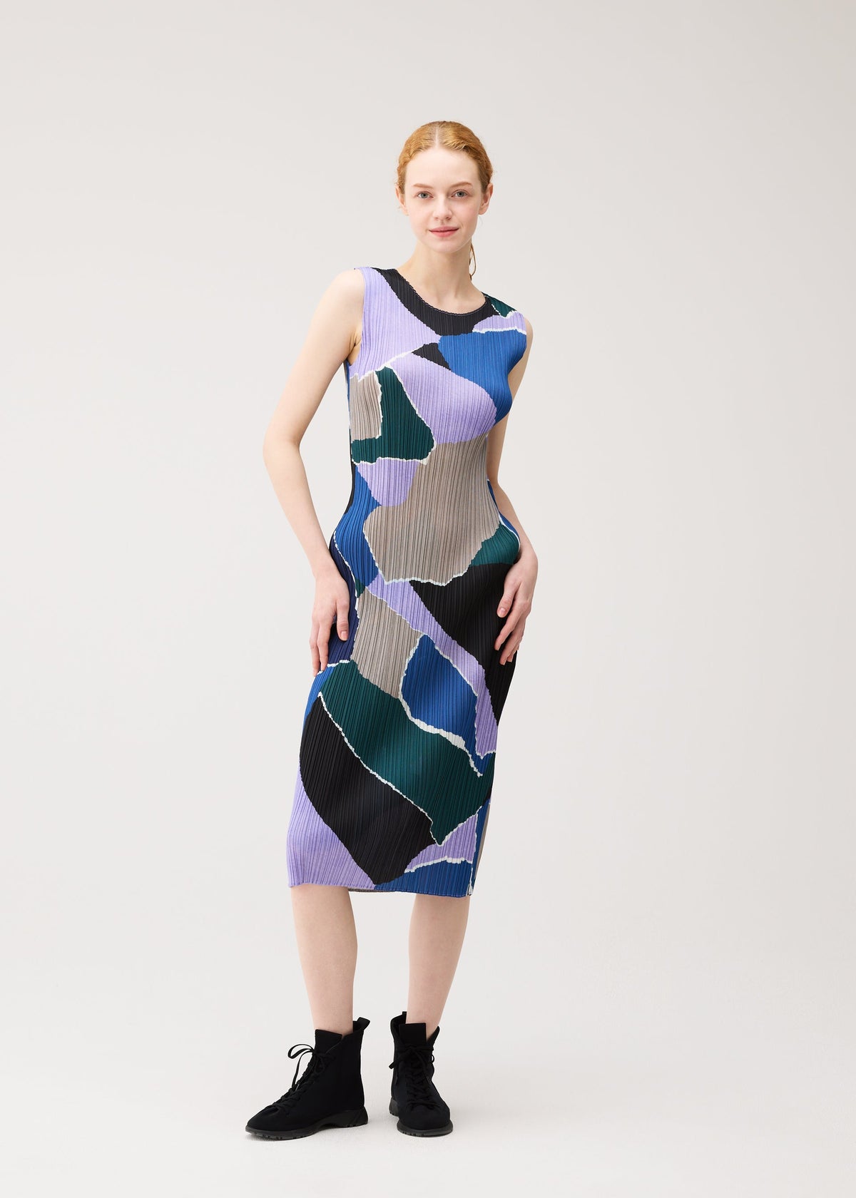 A model wears the PLEATS PLEASE ISSEY MIYAKE SURPRISE! dress.