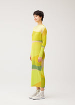 A model wears the PLEATS PLEASE ISSEY MIYAKE ORBIT dress.
