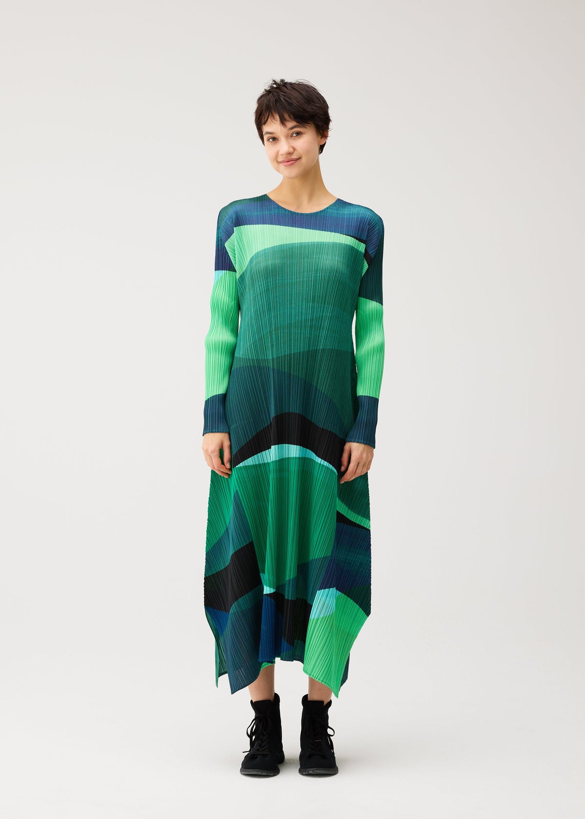 A model wears the PLEATS PLEASE ISSEY MIYAKE ORBIT dress.