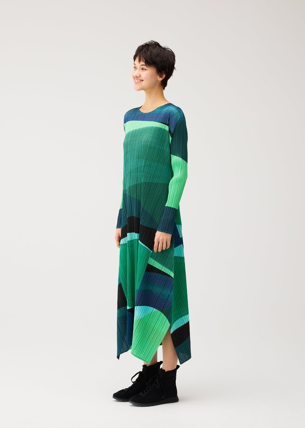 A model wears the PLEATS PLEASE ISSEY MIYAKE ORBIT dress.