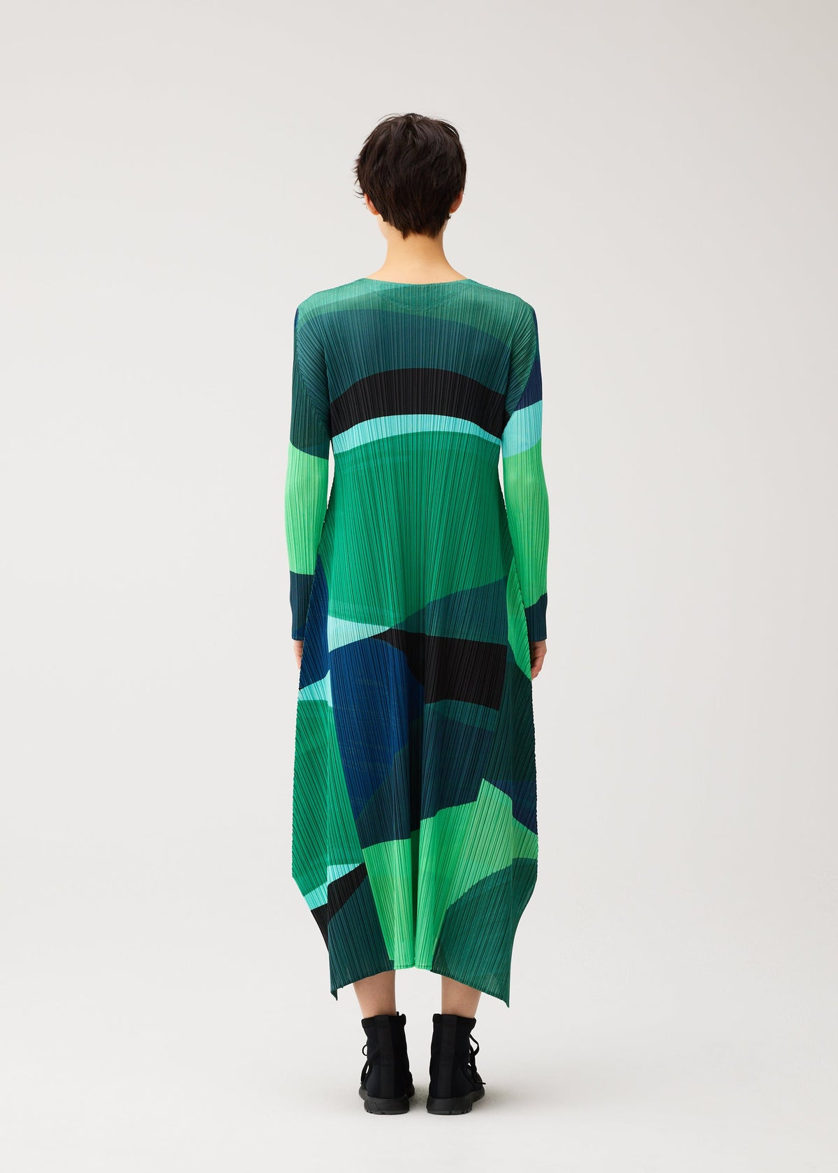 A model wears the PLEATS PLEASE ISSEY MIYAKE ORBIT dress.