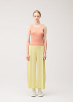 A model wears the PLEATS PLEASE ISSEY MIYAKE MONTHLY COLORS : JULY monthly-colors-july-shirt-black.