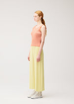 A model wears the PLEATS PLEASE ISSEY MIYAKE MONTHLY COLORS : JULY monthly-colors-july-shirt-pale-yellow-2.