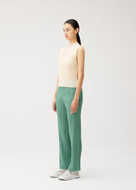 A model wears the PLEATS PLEASE ISSEY MIYAKE MONTHLY COLORS : AUGUST monthly-colors-august-shirt-off-white.