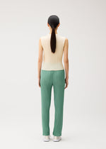 A model wears the PLEATS PLEASE ISSEY MIYAKE MONTHLY COLORS : AUGUST monthly-colors-august-shirt-charcoal.