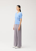 A model wears the PLEATS PLEASE ISSEY MIYAKE MONTHLY COLORS : AUGUST monthly-colors-august-shirt-greyish-purple-1.