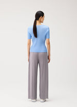 A model wears the PLEATS PLEASE ISSEY MIYAKE MONTHLY COLORS : AUGUST monthly-colors-august-shirt-charcoal-1.