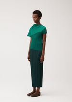 A model wears the PLEATS PLEASE ISSEY MIYAKE LEAP shirt.