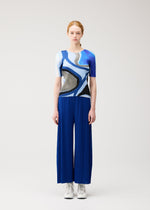 A model wears the PLEATS PLEASE ISSEY MIYAKE ROLL roll-shirt-multi-1.