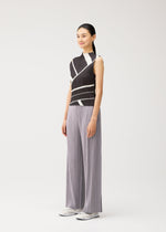 A model wears the PLEATS PLEASE ISSEY MIYAKE FOLD LINE fold-line-shirt-off-white.