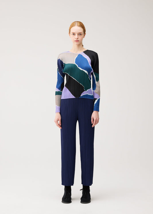 A model wears the PLEATS PLEASE ISSEY MIYAKE SURPRISE! shirt.