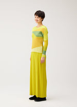 A model wears the PLEATS PLEASE ISSEY MIYAKE ORBIT shirt.