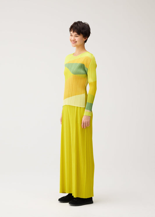 A model wears the PLEATS PLEASE ISSEY MIYAKE ORBIT shirt.