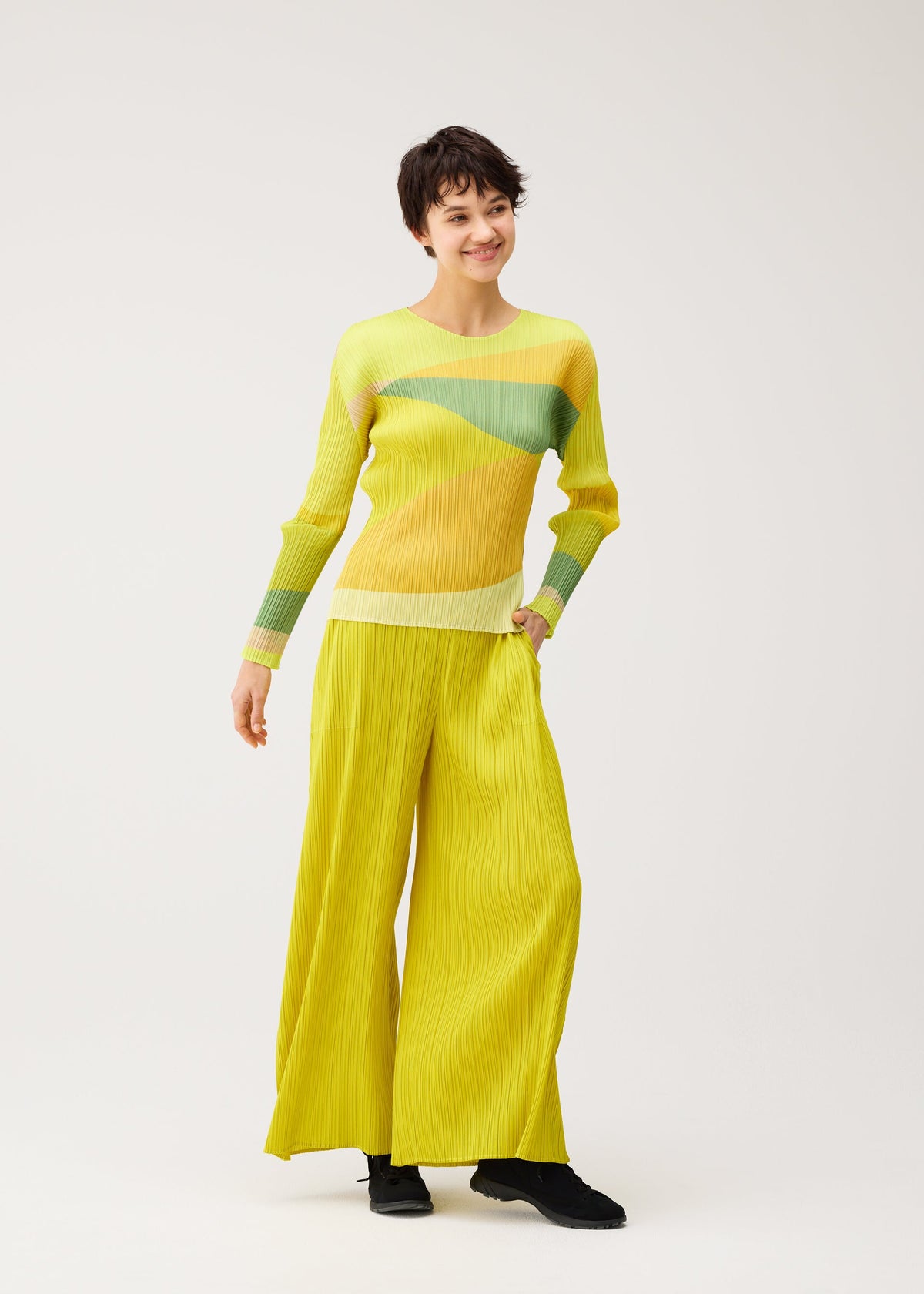 A model wears the PLEATS PLEASE ISSEY MIYAKE ORBIT shirt.