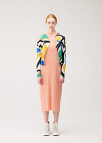 A model wears the PLEATS PLEASE ISSEY MIYAKE ROLL roll-cardigan-multi-1.