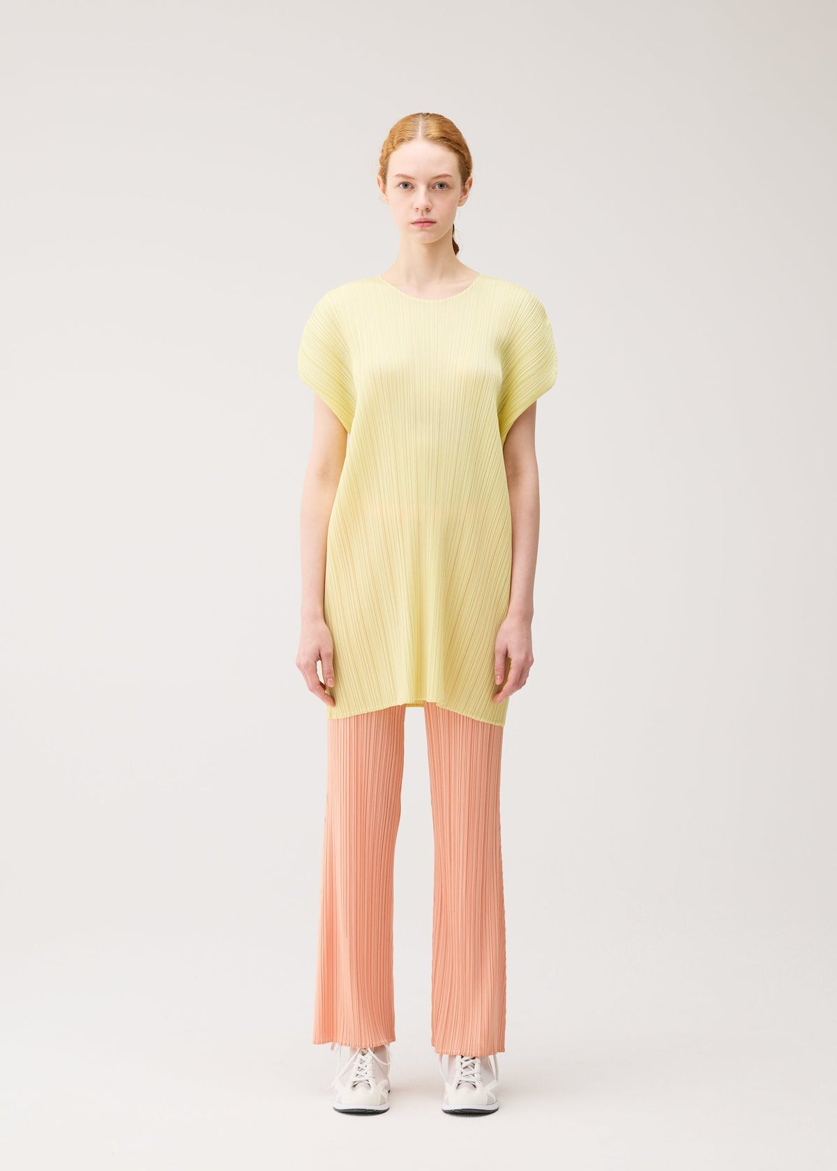 A model wears the PLEATS PLEASE ISSEY MIYAKE MONTHLY COLORS : JULY monthly-colors-july-dress-black-5-fw26.