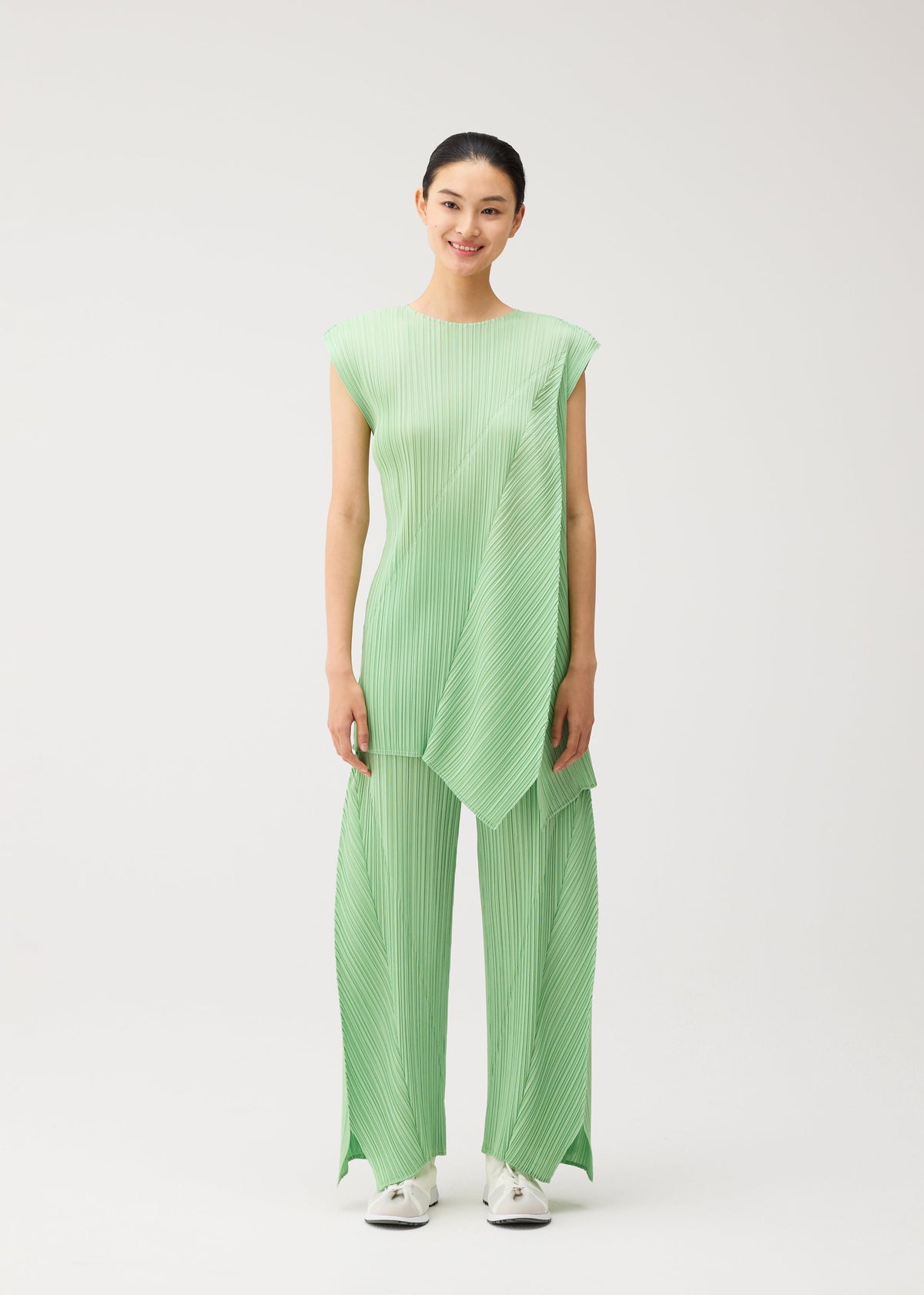 A model wears the PLEATS PLEASE ISSEY MIYAKE FOLD fold-dress-black-1.
