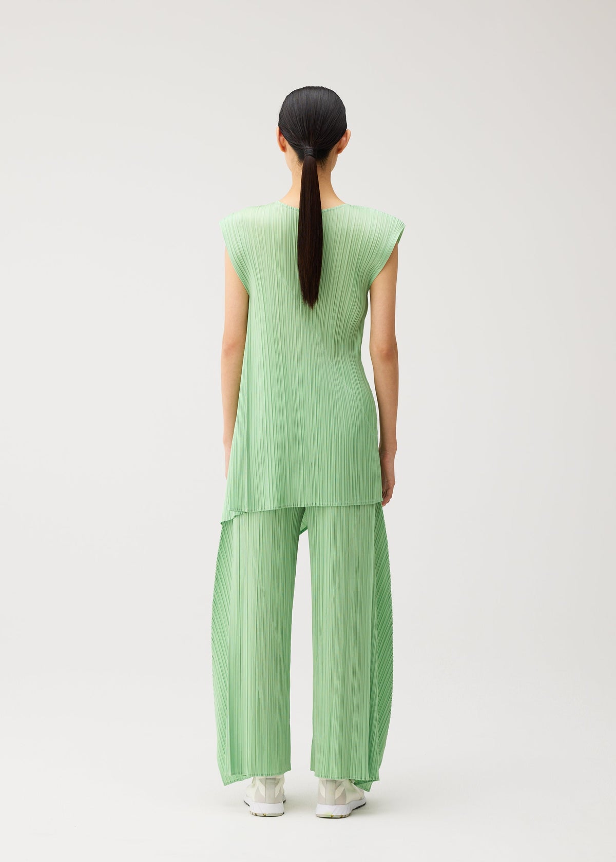 A model wears the PLEATS PLEASE ISSEY MIYAKE FOLD fold-dress-black-1.